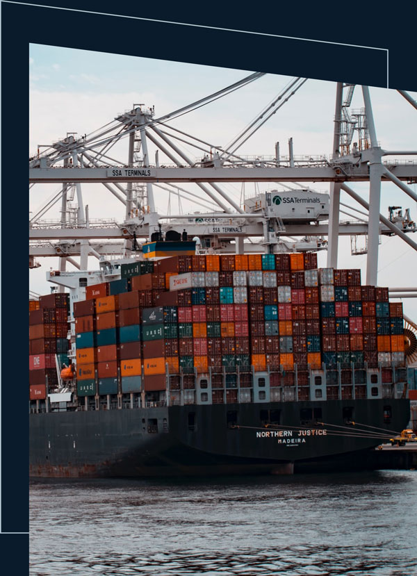 Large cargo ship docked at port.